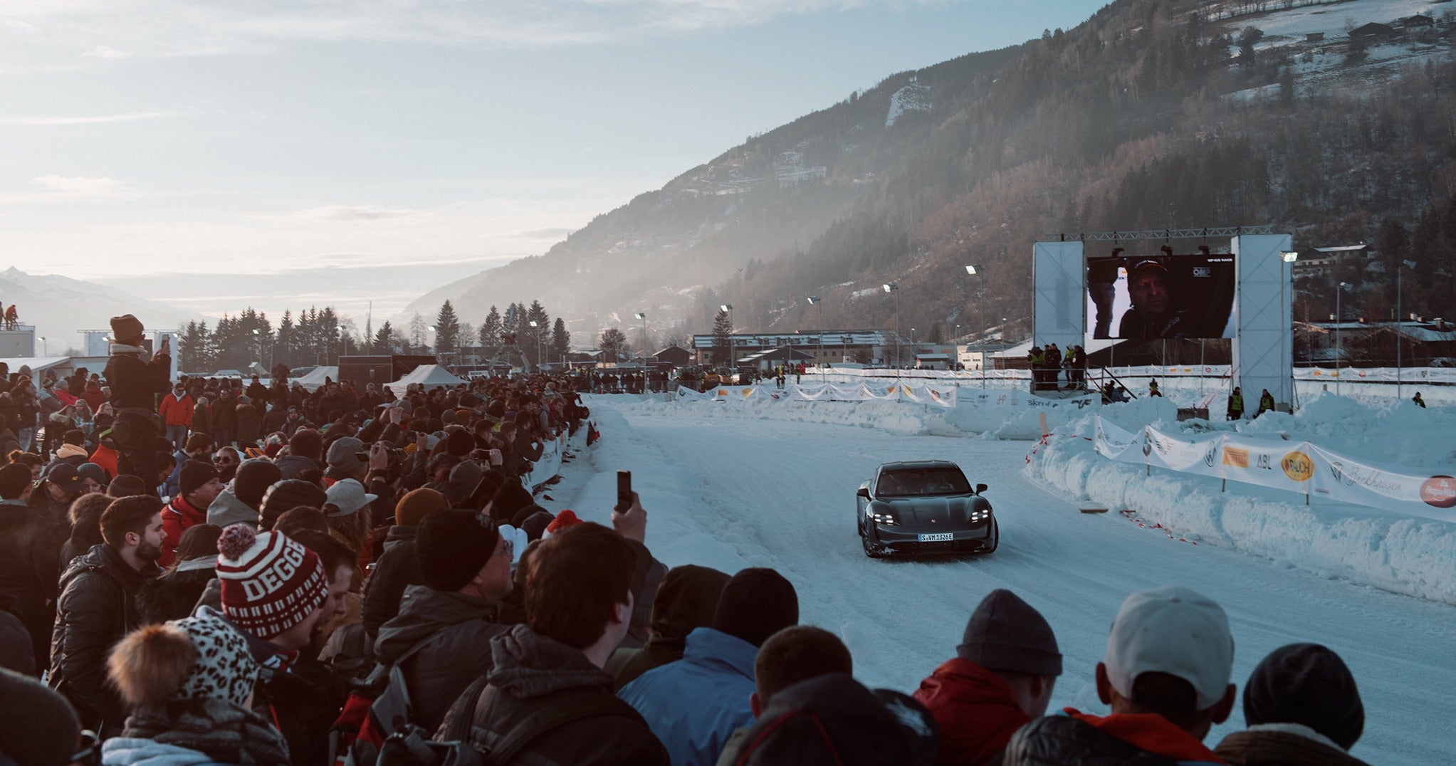 <span>Spectators at the 2020 Ice Race watch as Porsche&rsquo;s new Taycan Turbo S takes its turn on the track</span> <br/><span class="caption-sub"><em>Photo credit: F.A.T. International</em></span><br/>